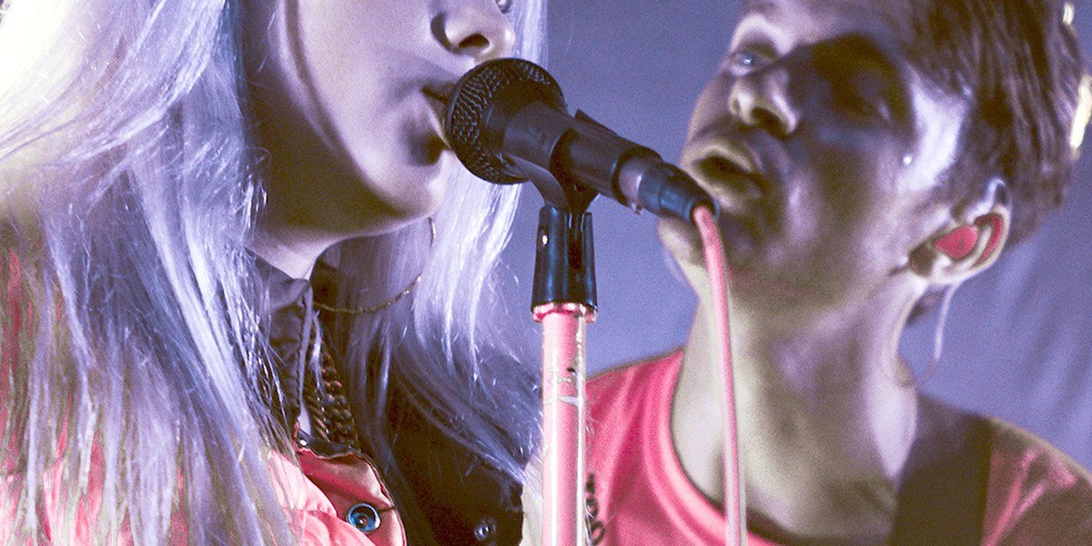 Billie Eilish and her brother Finneas standing together at an event in 2017