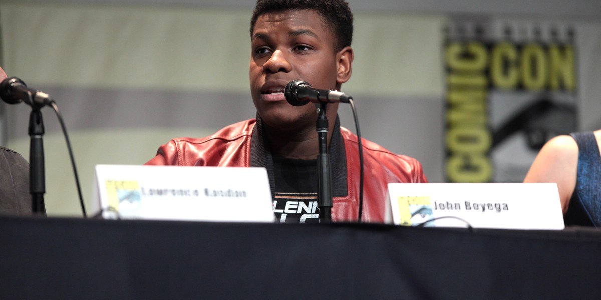 John Boyega seated at the 2015 San Diego Comic-Con Star Wars panel