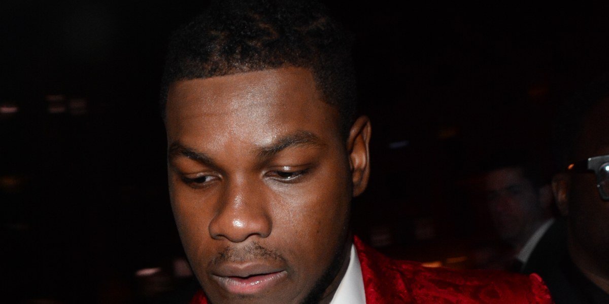 John Boyega in a red suit at a London fashion party in 2020