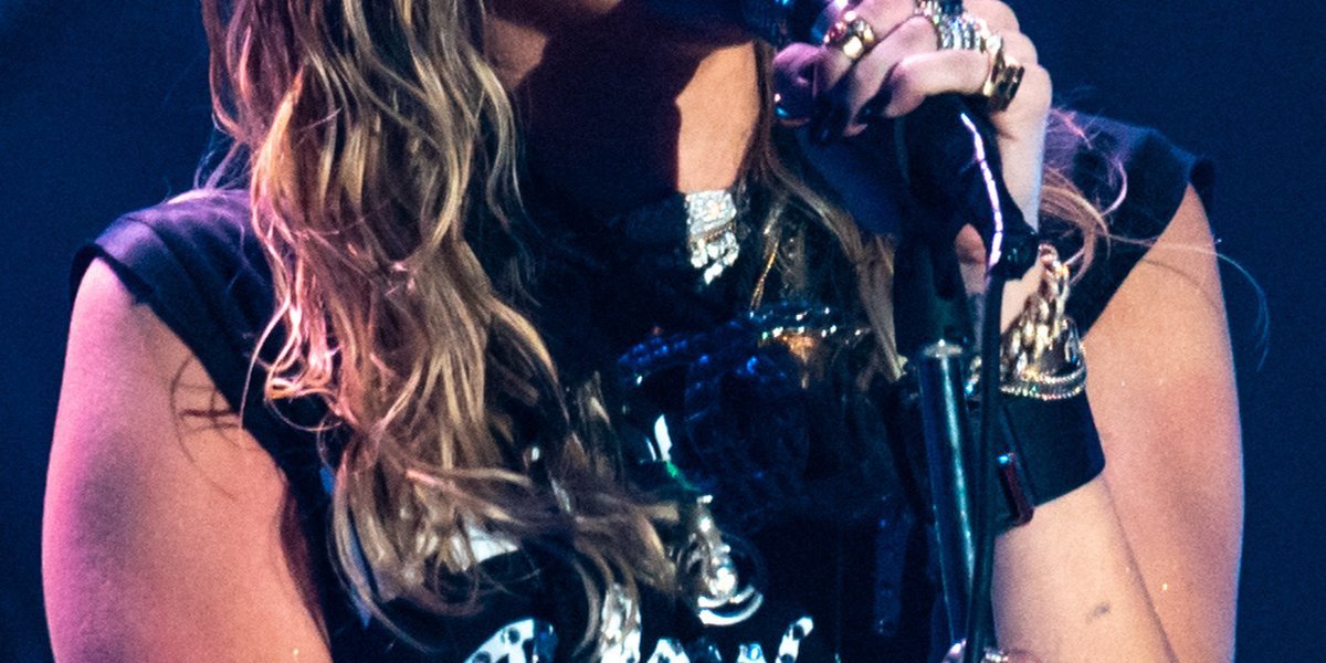 Miley Cyrus singing into a microphone on stage at Primavera Sound 2019