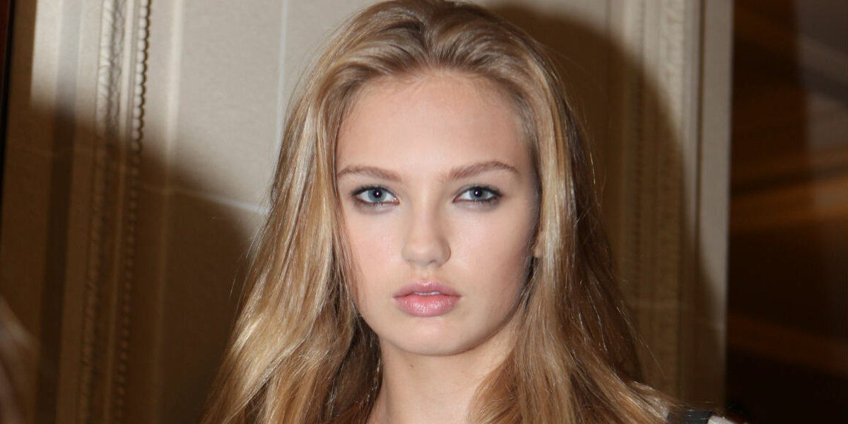 Portrait of young Romee Strijd in 2011 with long blonde hair wearing a light blouse